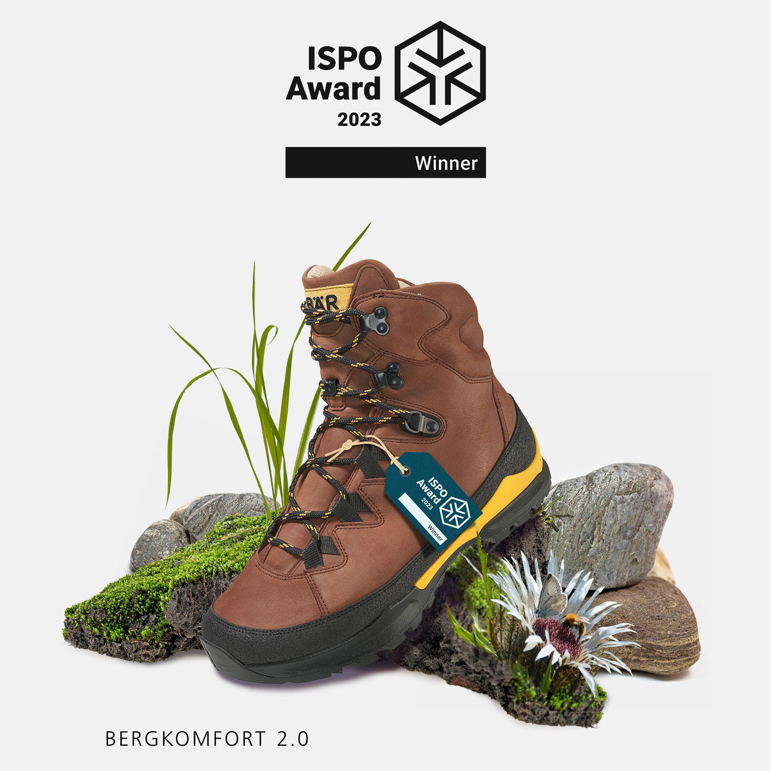 Brauner Wanderstiefel Bergkomfort 2.0 mit ISPO Award 2023, dekoriert mit Pflanzen und Steinen