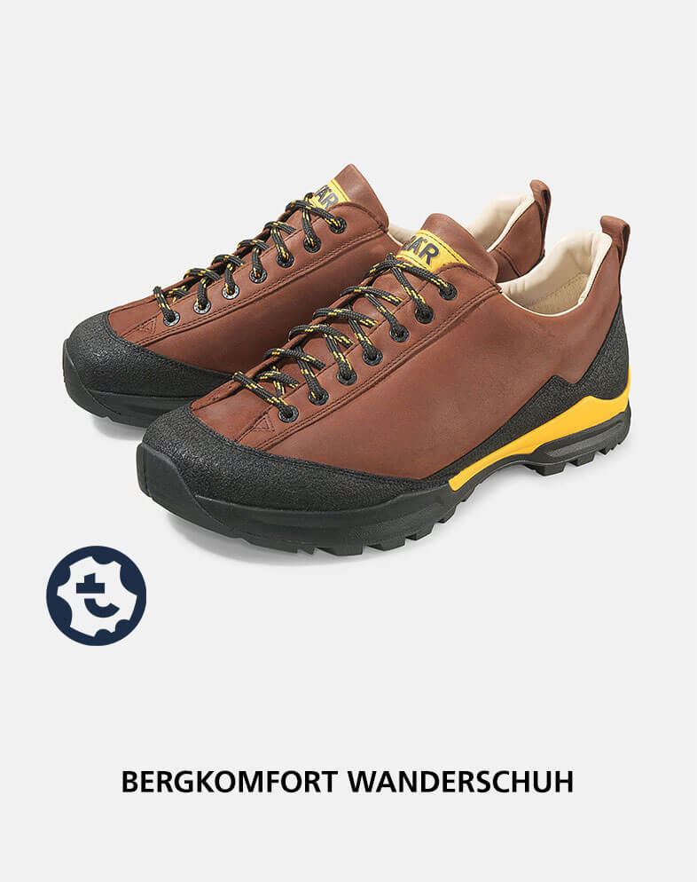 Robuster brauner Wanderschuh mit schwarzer Gummisohle und gelben Details, ideal für Outdoor-Abenteuer