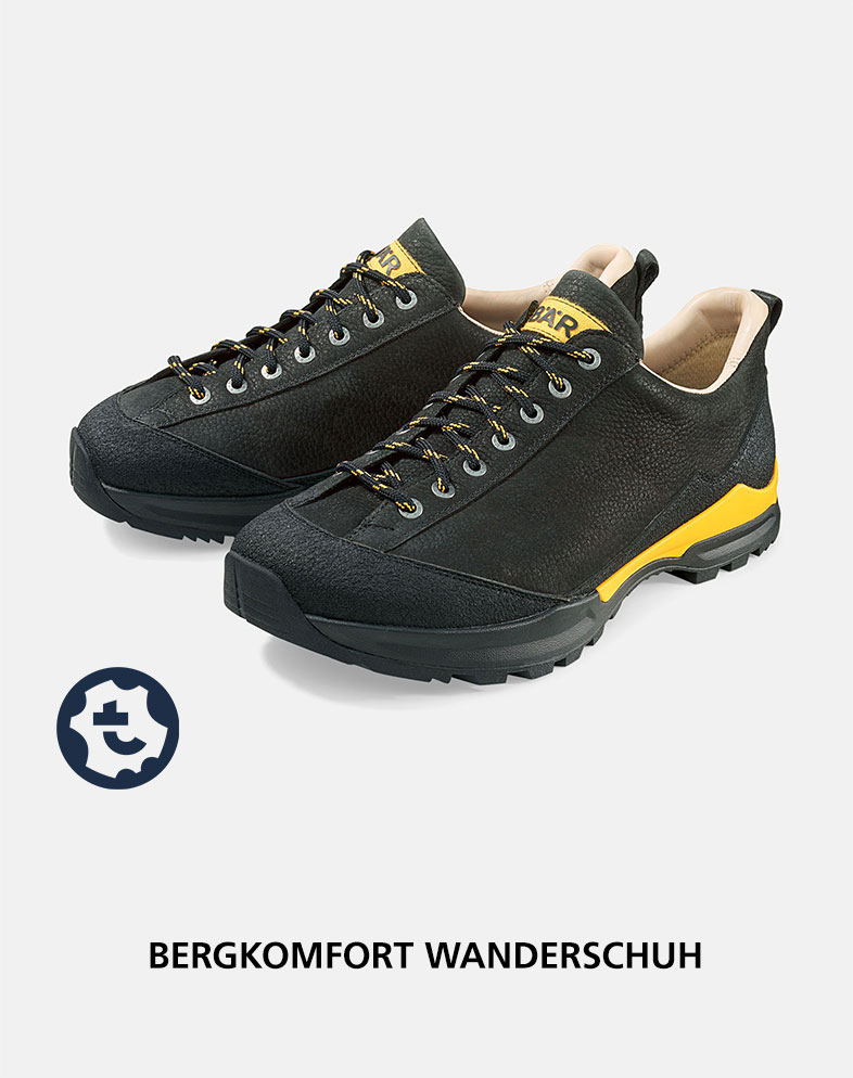 Schwarzer Wanderschuh mit gelben Akzenten, ideal für Bergwanderungen. Zeigt die detailreiche Verarbeitung und haltbare Sohle.