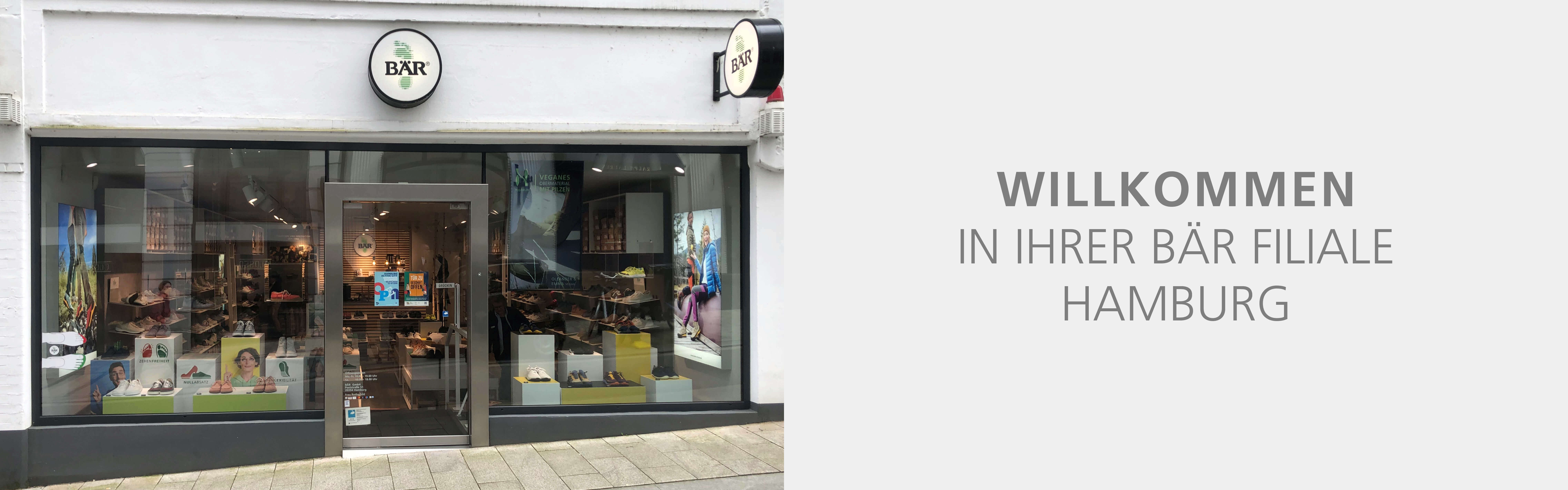 Außenansicht der BÄR Schuhgeschäft-Filiale in Hamburg mit Schaufensterdekoration und Willkommensschriftzug.